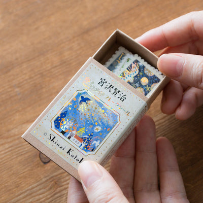 Postage flake stickers in a match box -The cat's office-