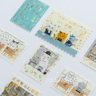 Postage flake stickers in a match box -The cat's office-