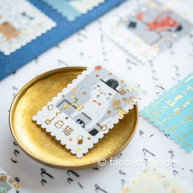 Postage flake stickers in a match box -The cat&