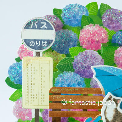 Greeting card -bus stop in the rain-