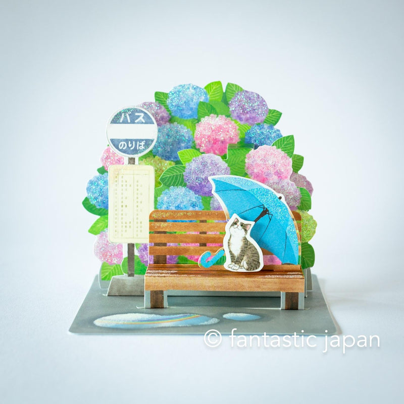 Greeting card -bus stop in the rain-