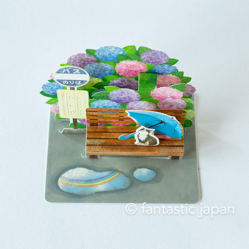 Greeting card -bus stop in the rain-