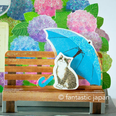Greeting card -bus stop in the rain-