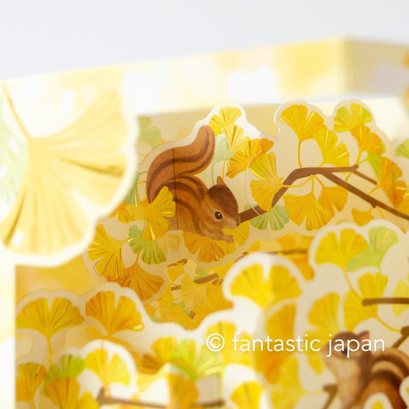 Autumn greeting card -ginkgo tree and  squirrel-