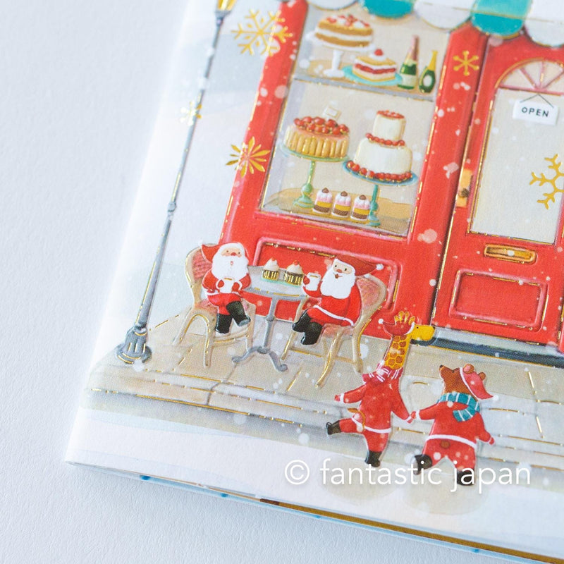 Christmas pop up card -Santa Clauses in the candy shop-
