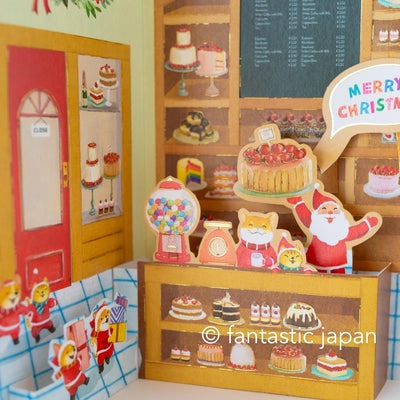 Christmas pop up card -Santa Clauses in the candy shop-