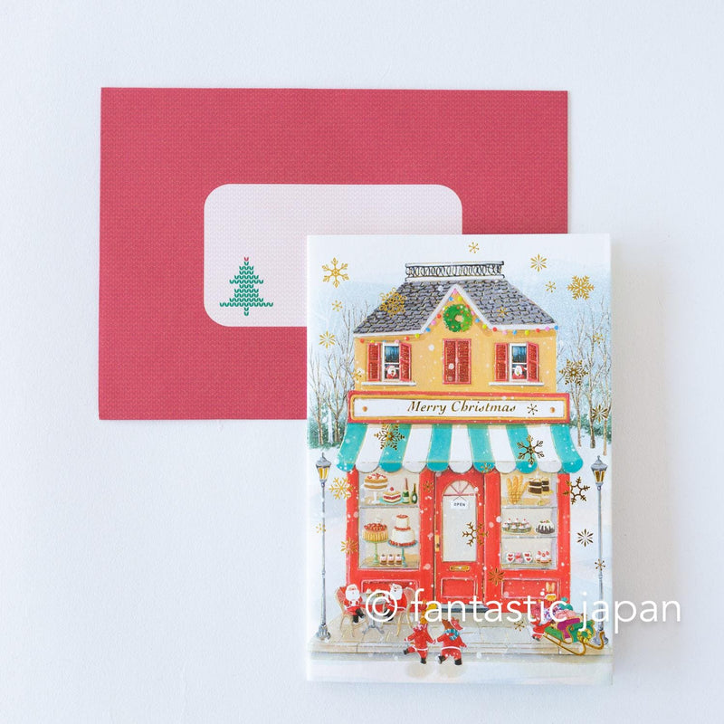 Christmas pop up card -Santa Clauses in the candy shop-