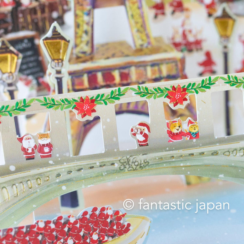 Christmas pop up card -Santa Clauses in Paris-