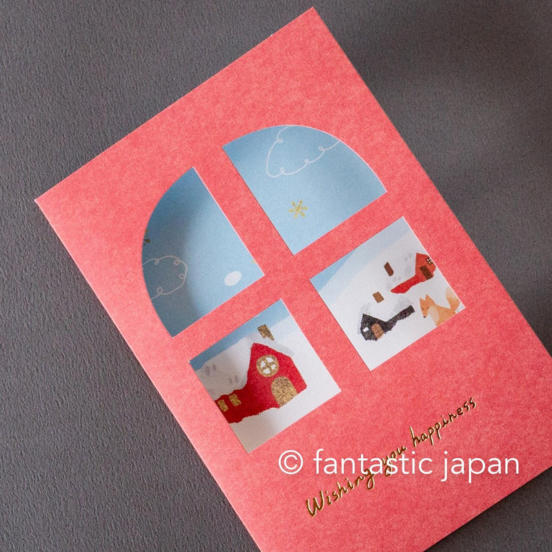 Greeting card with window -A snowy landscape and a cottage-