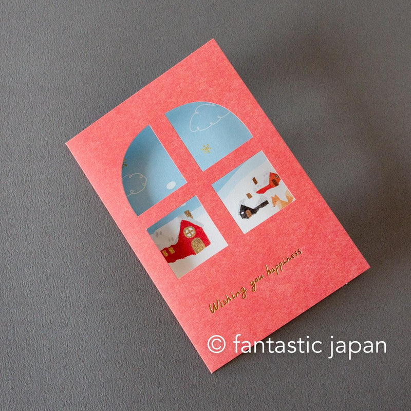 Greeting card with window -A snowy landscape and a cottage-