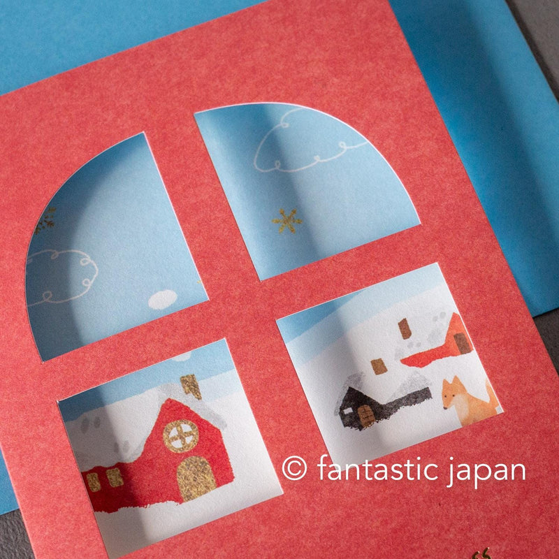 Greeting card with window -A snowy landscape and a cottage-