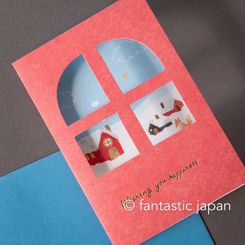 Greeting card with window -A snowy landscape and a cottage-