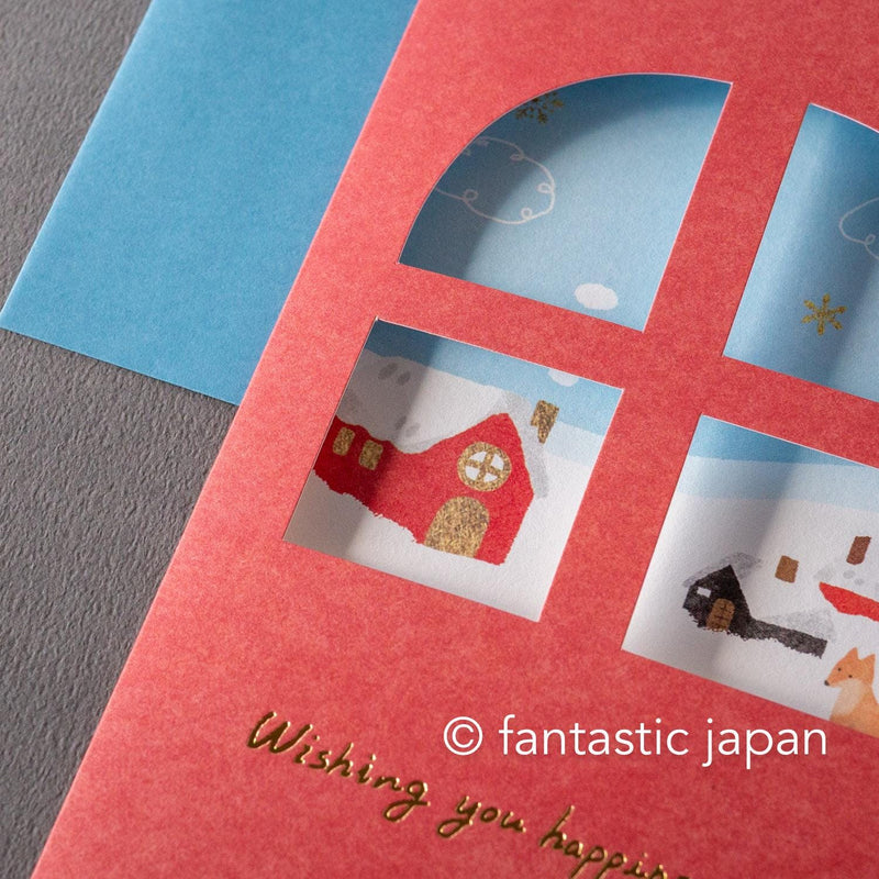 Greeting card with window -A snowy landscape and a cottage-