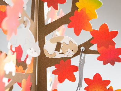 Greeting card "Autumn greeting -cat playing on the red leaf tree-