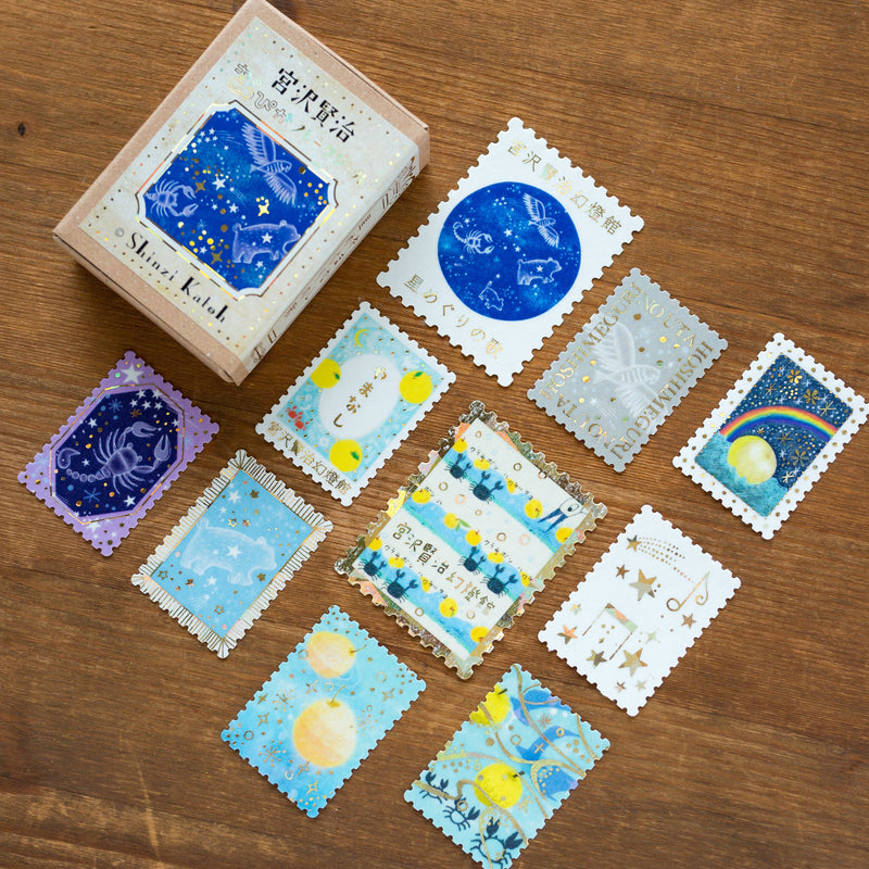 Postage flake stickers in a match box -The Star Circling song-