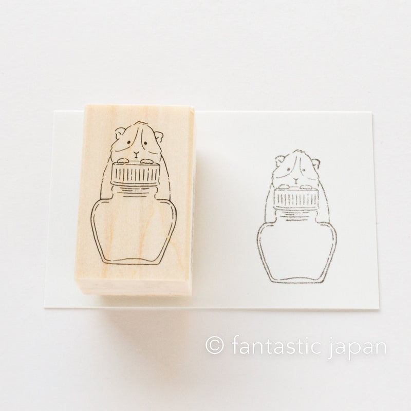 The buddy of inks -guinea pig on ink bottle-