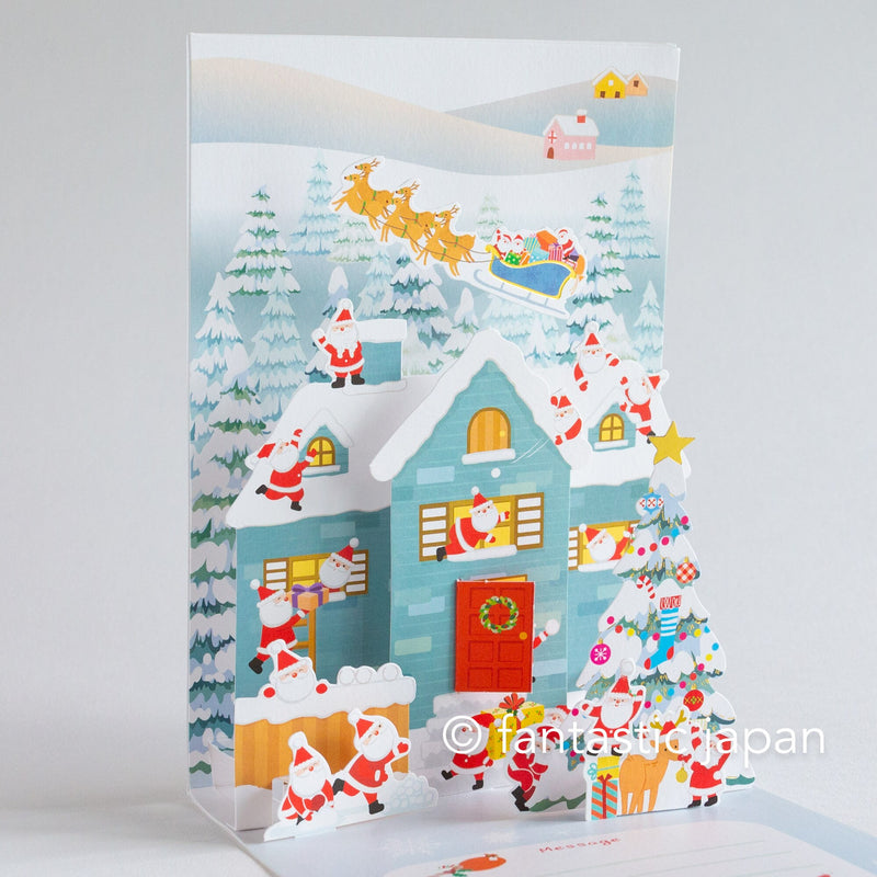 Christmas pop up card -Santa Clauses in the snowy house-