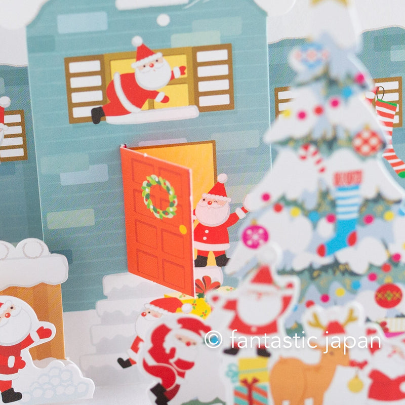 Christmas pop up card -Santa Clauses in the snowy house-