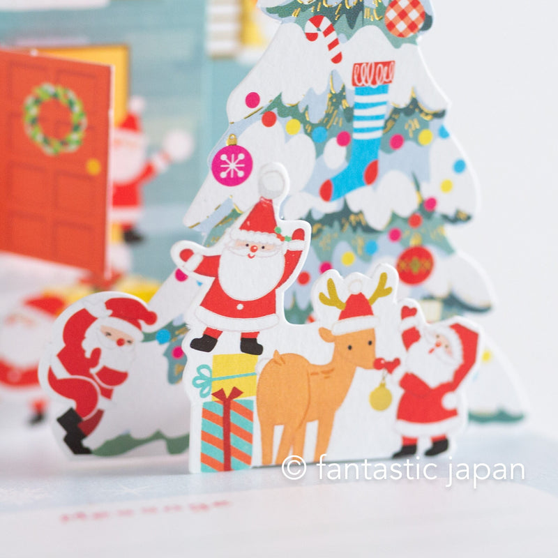 Christmas pop up card -Santa Clauses in the snowy house-