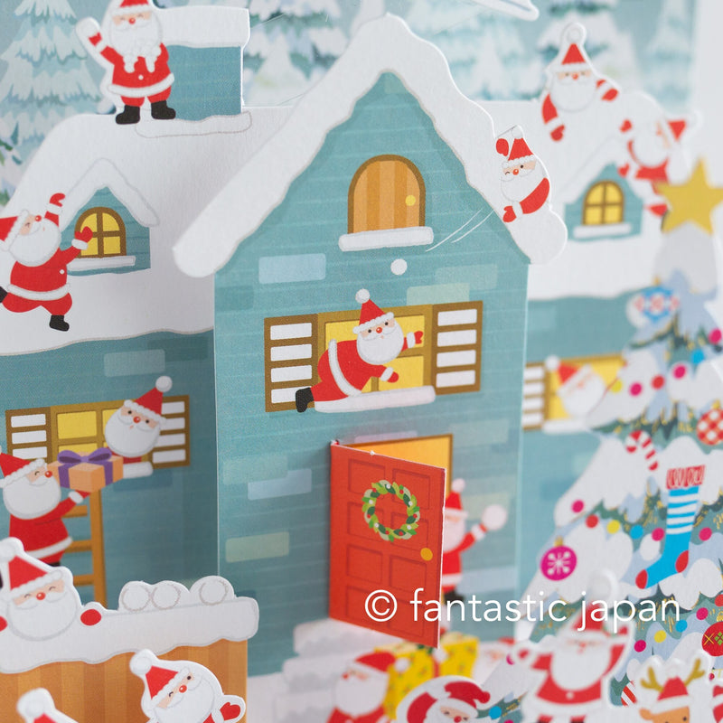 Christmas pop up card -Santa Clauses in the snowy house-