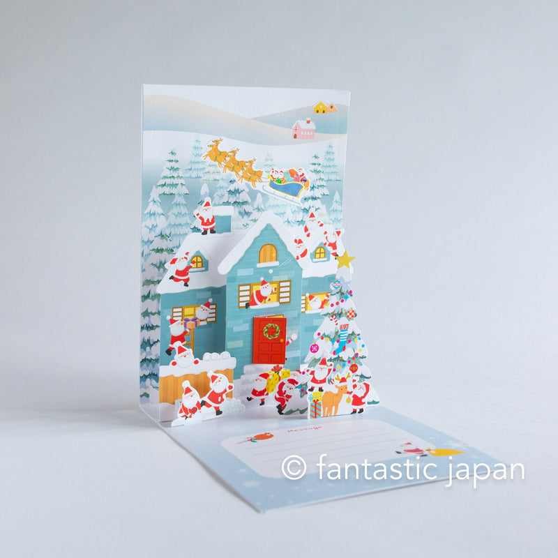 Christmas pop up card -Santa Clauses in the snowy house-