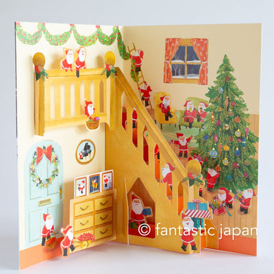 Christmas pop up card -Santa Clauses in the house with large staircase-