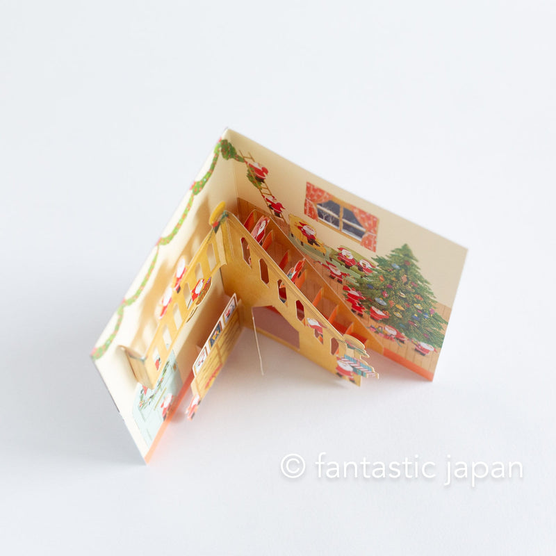 Christmas pop up card -Santa Clauses in the house with large staircase-