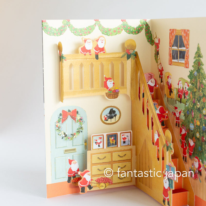 Christmas pop up card -Santa Clauses in the house with large staircase-