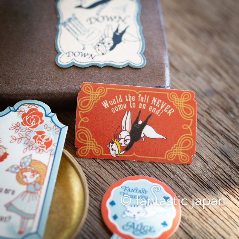 Flake stickers in a small tin box / Alice&
